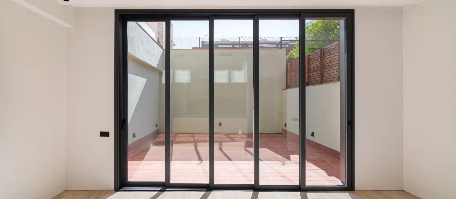 shadows-floor-from-sunlight-through-big-windows-new-room-with-wooden-floor-refurbished